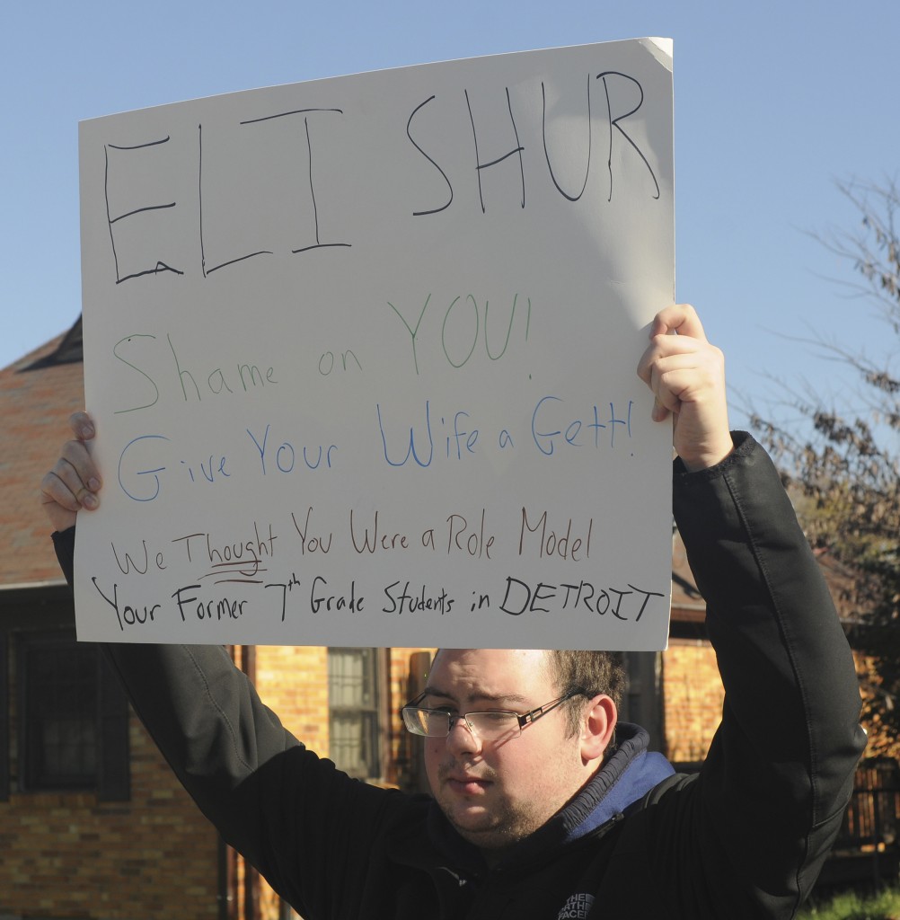 Yackov Burstyn of Shomrey Emunah in Southfield, Mich. holds a sign at the ORA-sponsored rally on Nov. 8 in Kettering, Ohio