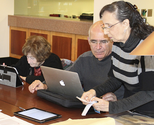 Renana Harel’s grandmother, Tikva Dolev, and her parents, Danny and Nava Dolev, research family genealogy at the American Jewish Archives in Cincinnati last year