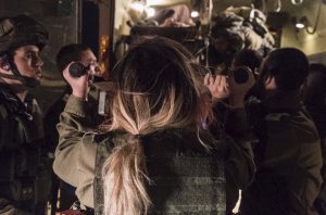 Israeli soldiers attend to wounded Syrians at the border, April 6. Photo: IDF