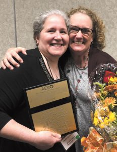 Hallie Greenfield (L) received the AERO 2018 Outstanding Ohio Orientation and Mobility Specialist Award from Dr. Danene Fast 