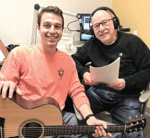 Jerry Halasz (R) and grandson Grant Halasz record a Chanukah program for Radio Reading Service. Photo: RRS.